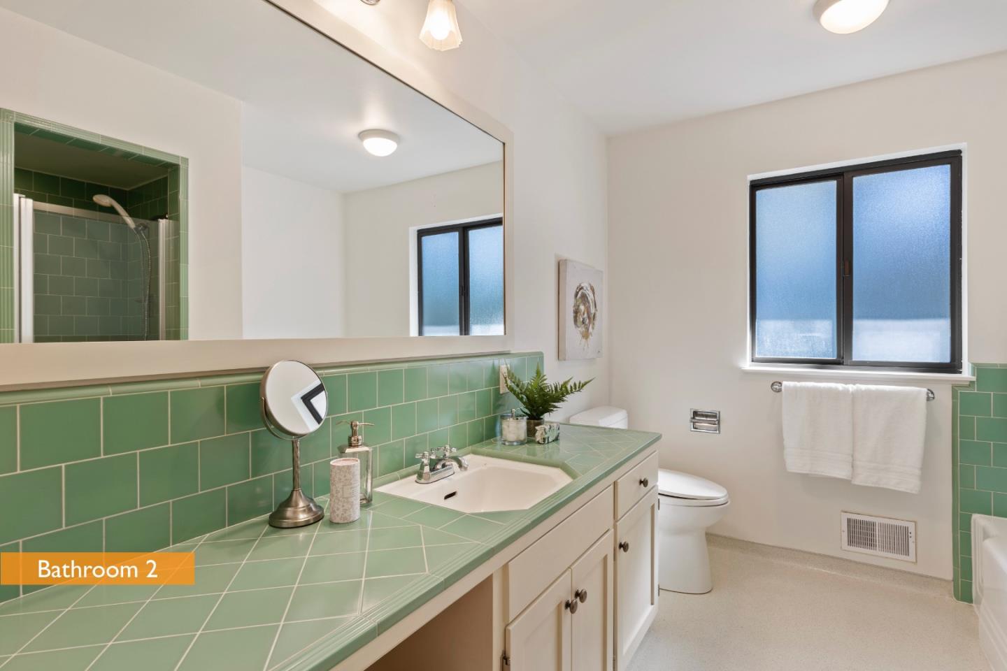 460 Aspen Way Los Altos, CA 94024 - Photo 21 of 30 a bathroom with a sink a toilet and mirror