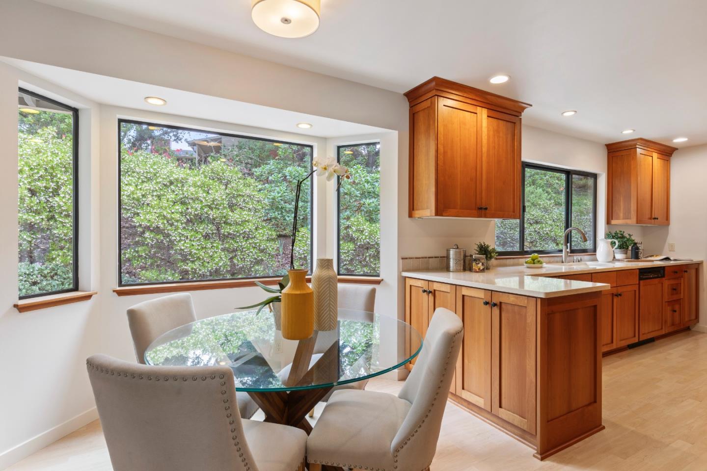 460 Aspen Way Los Altos, CA 94024 - Photo 6 of 30 a dining table with a large window and a kitchen