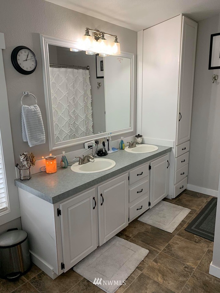 1769 Pangborn Road Lynden, WA 98264 - Photo 12 of 37 a bathroom with a sink double vanity and a mirror