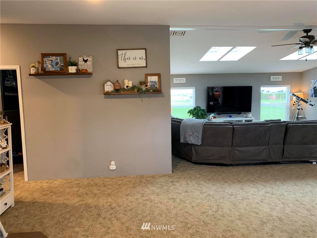 1769 Pangborn Road Lynden, WA 98264 - Photo 15 of 37 a living room with furniture and a flat screen tv