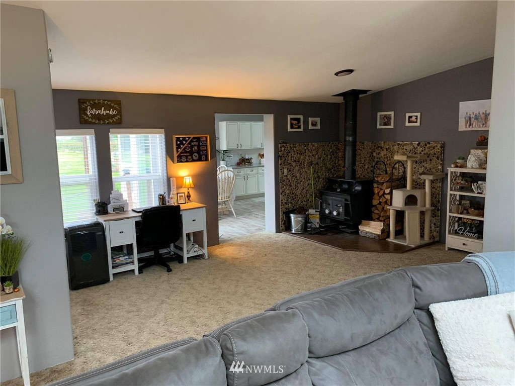 1769 Pangborn Road Lynden, WA 98264 - Photo 16 of 37 a bed room with a bed and a chair