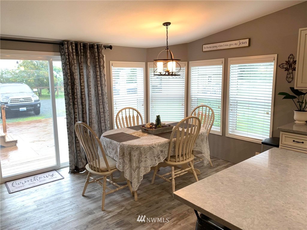 1769 Pangborn Road Lynden, WA 98264 - Photo 3 of 37 a view of a dining room with furniture window and wooden floor