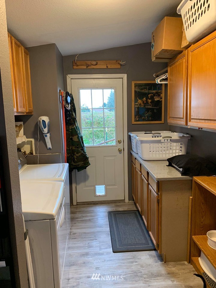 1769 Pangborn Road Lynden, WA 98264 - Photo 26 of 37 a kitchen that has a sink a stove and a microwave