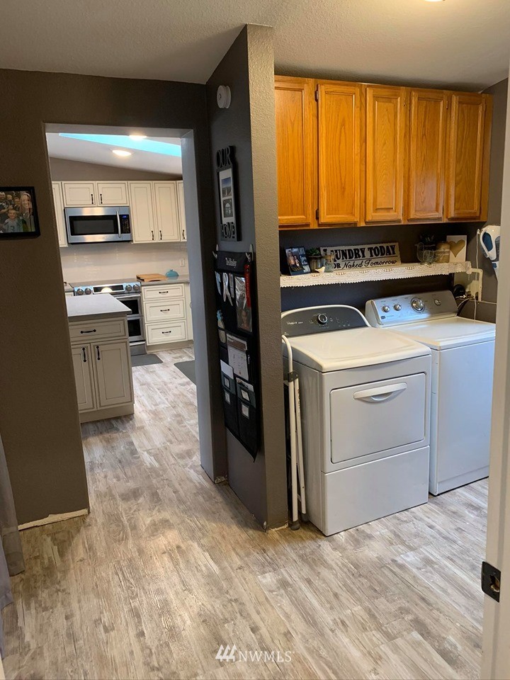 1769 Pangborn Road Lynden, WA 98264 - Photo 27 of 37 a kitchen with stainless steel appliances a stove sink and cabinets