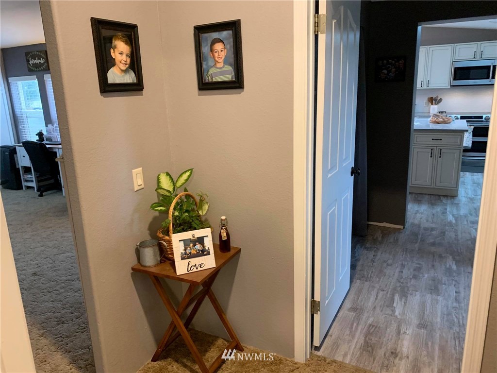 1769 Pangborn Road Lynden, WA 98264 - Photo 28 of 37 a view of a hallway with wooden floor and furniture