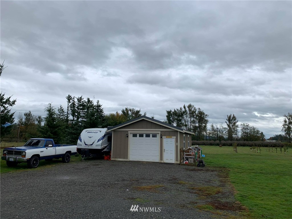 1769 Pangborn Road Lynden, WA 98264 - Photo 35 of 37 a view of a car parked in front of a house with a big yard