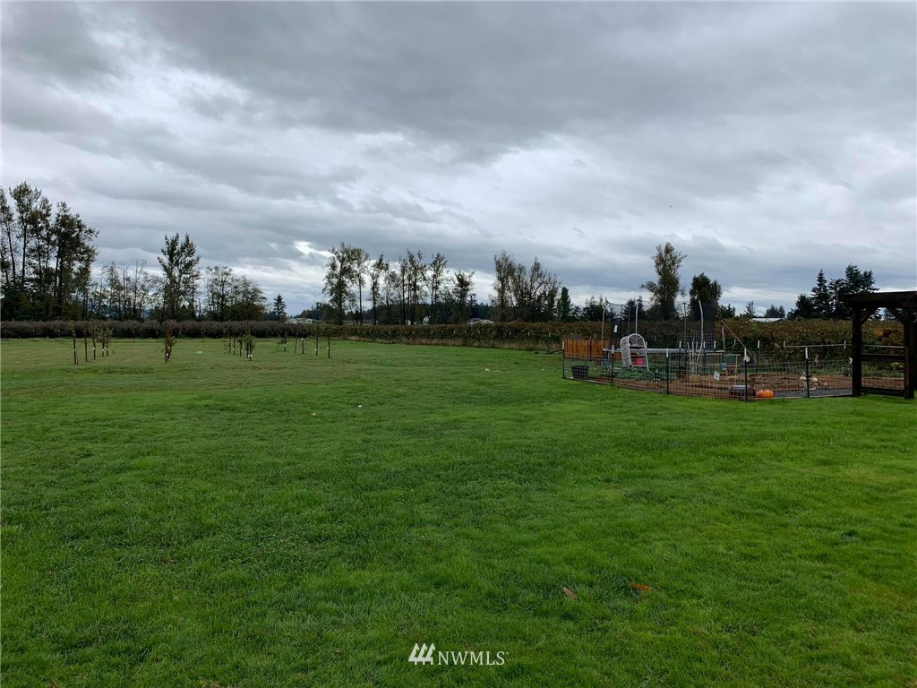 1769 Pangborn Road Lynden, WA 98264 - Photo 36 of 37 a view of a golf course with a lake