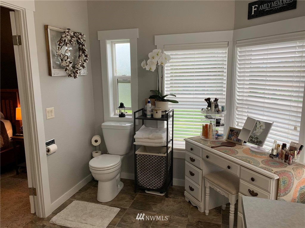 1769 Pangborn Road Lynden, WA 98264 - Photo 10 of 37 a bathroom with a toilet a sink and a window