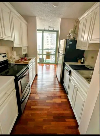 a view of a living room and dining room