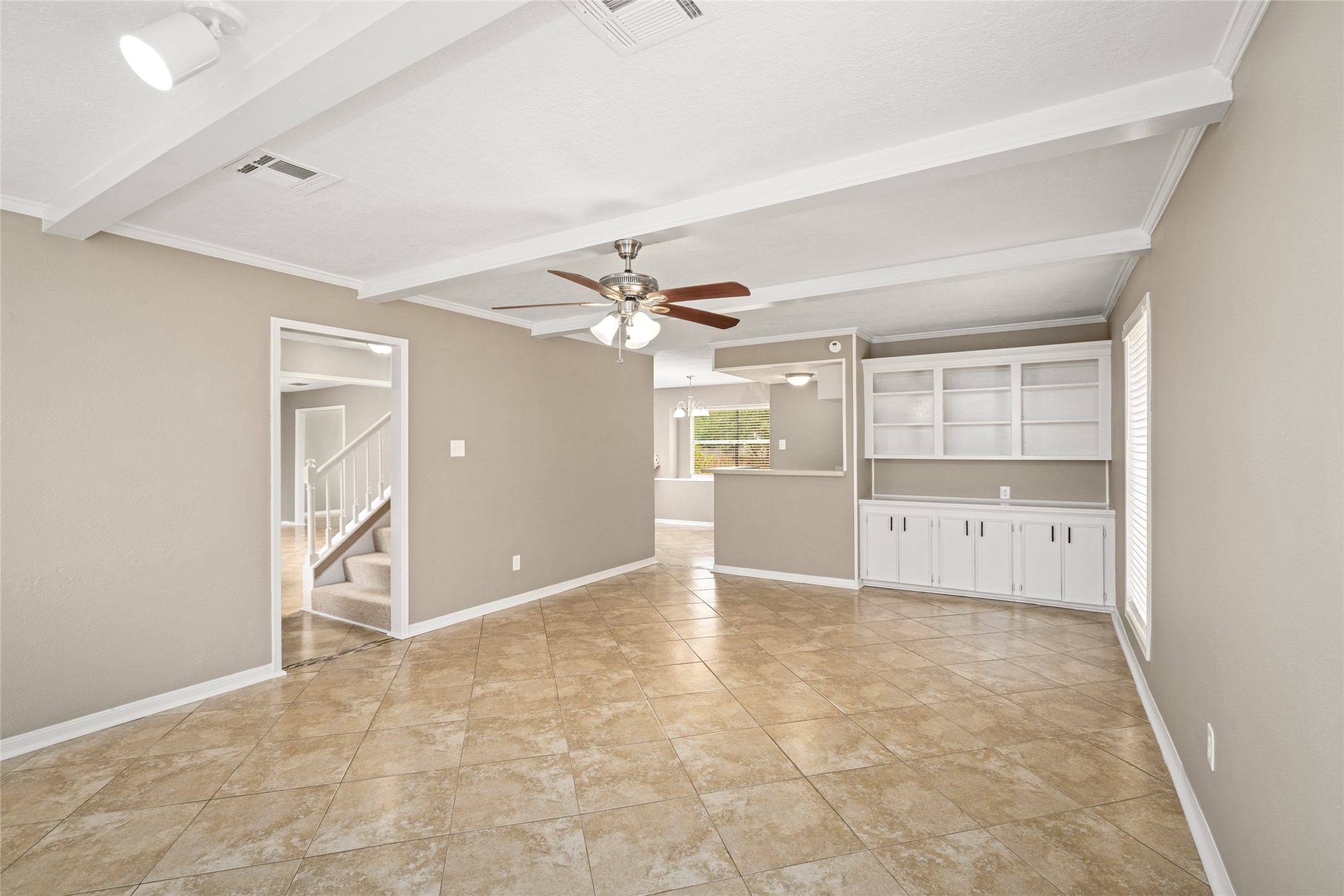 24915 Butterwick Drive Spring, TX 77389 - Photo 10 of 20 You will love the built-in storage and organization! This view shows the seamless flow between the family room and your kitchen/wet bar area