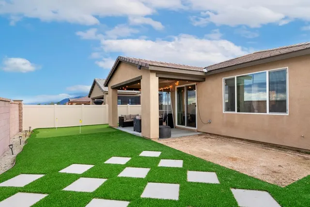 a view of house with yard