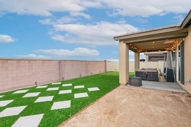 a view of a patio with a yard