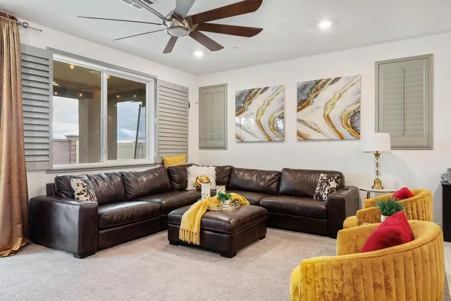 a living room with furniture and a window