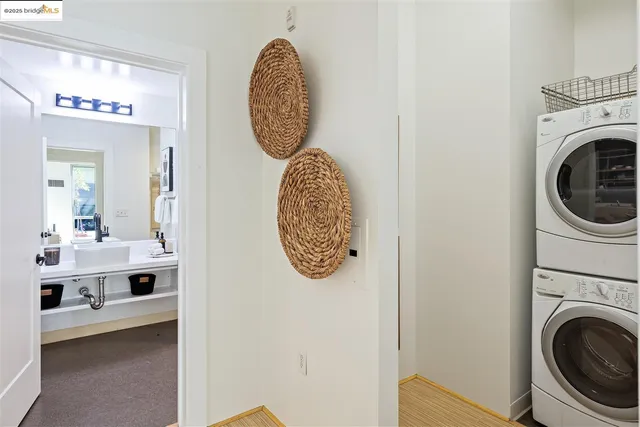 a view of a hallway with washer and dryer