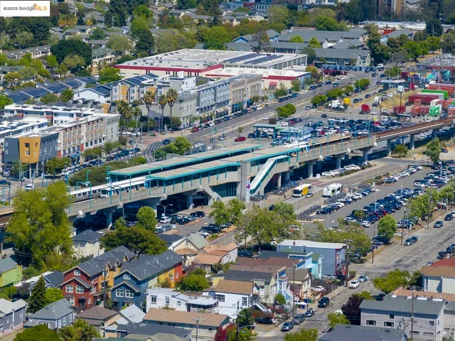 a view of a patio with table and chairs under an umbrella