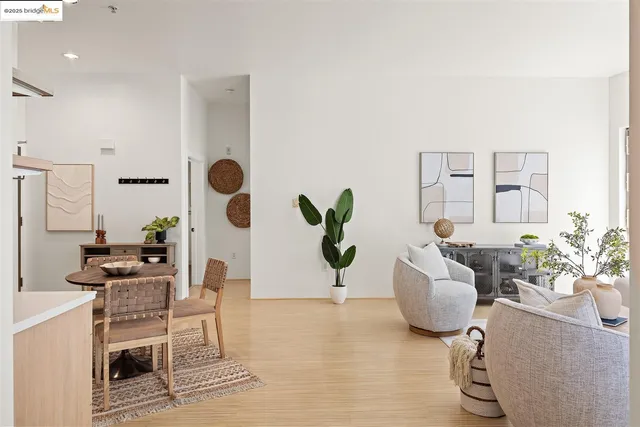 a view of living room filled with furniture and flowers