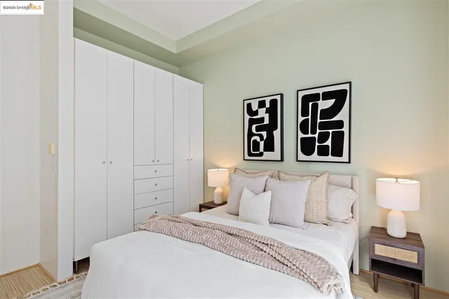 a bedroom with a bed and a lamp