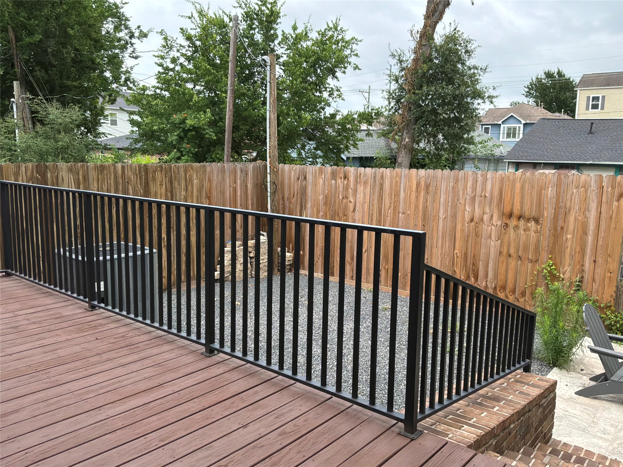 922 Alexander Street Houston, TX 77008 - Photo 34 of 43 Wood deck w/iron railing and handsome brick steps down onto stone patio on right and yard.