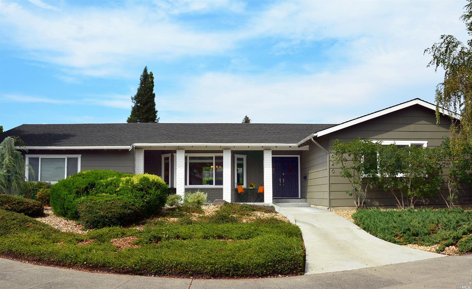 a front view of a house with garden