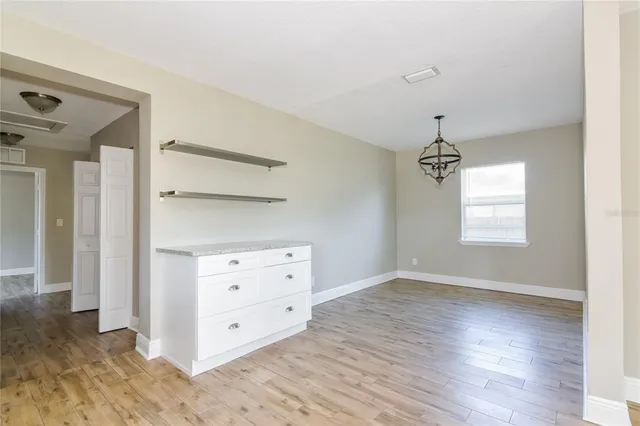 a view of an empty room and window