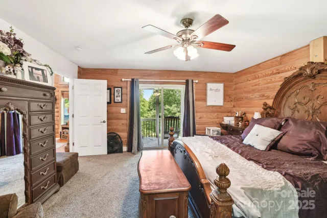 a bed room with a bed and balcony