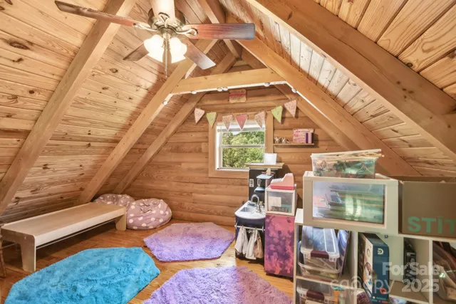 a living room with lots of furniture and kitchen view