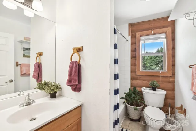 a white toilet sitting next to a bathroom sink