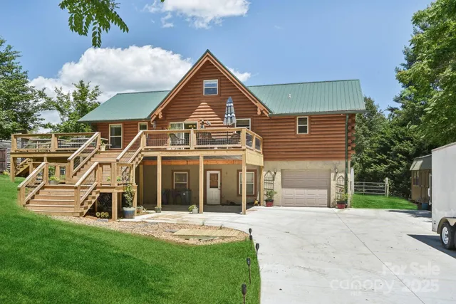 a view of a house with a backyard porch and sitting area