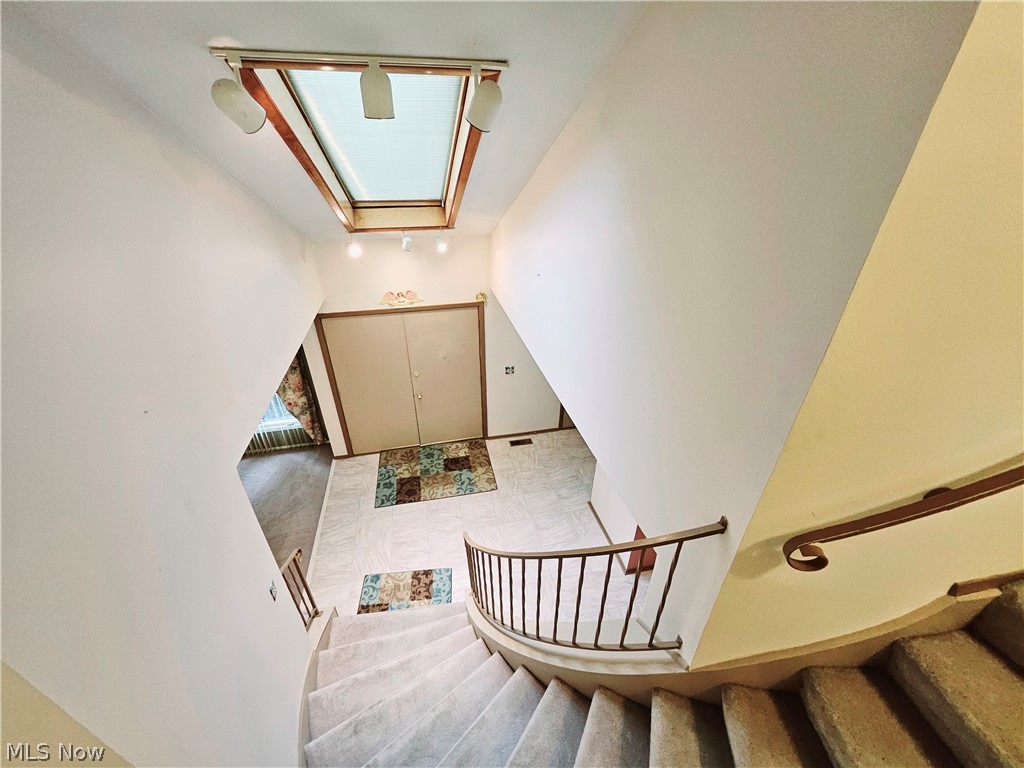16551 Drake Road Strongsville, OH 44136 - Photo 29 of 50 Stairway featuring a skylight and light tile floors