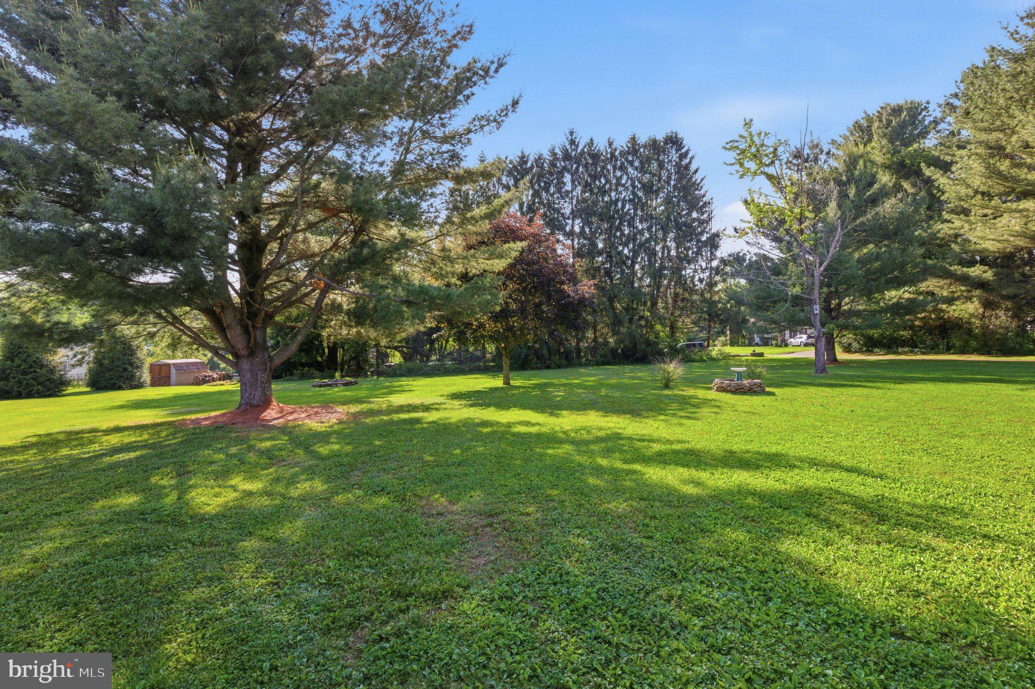 18310 Upper Beckleysville Road Hampstead, MD 21074 - Photo 55 of 67 Lush green oasis under clear skies.