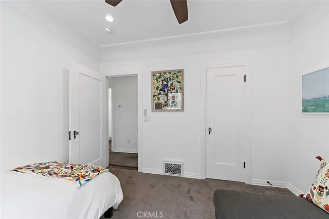 a bedroom with a bed and a cabinets