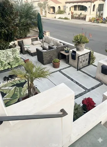 a view of a patio with couches table and chairs