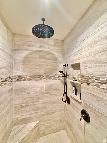 2101 Goose Ranch Road Vernal, UT 84078 - Photo 30 of 72 Rainfall shower head with bronze fixtures and light-toned tilework
