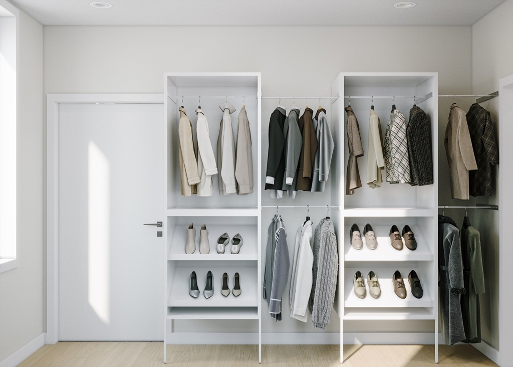 25 Adams Circle, Unit A Devens, MA 01434 - Photo 12 of 22 a view of walk in closet with clothes and shoes