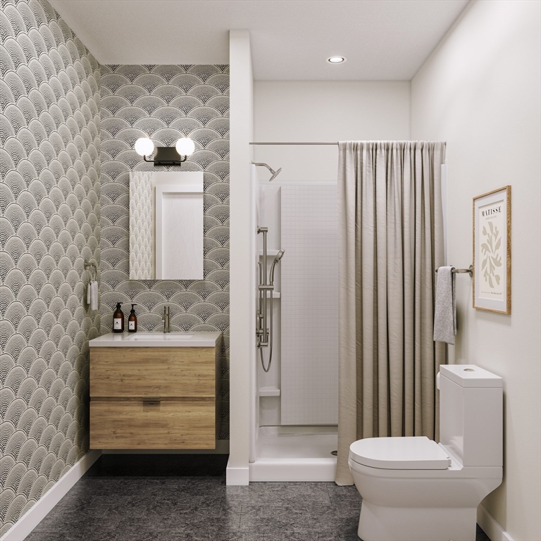 25 Adams Circle, Unit A Devens, MA 01434 - Photo 22 of 22 a bathroom with a toilet sink and shower