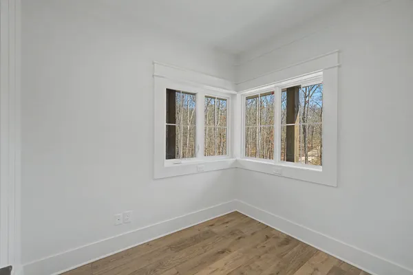 a living room with a fireplace furniture and a ceiling fan