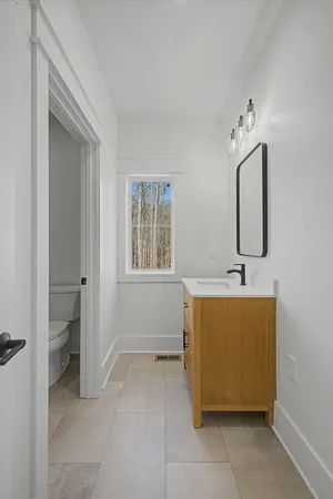 a view of an entryway with wooden floor
