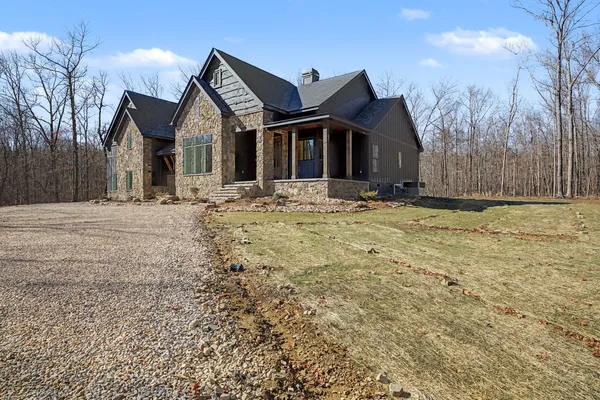 a view of a house with snow on the road