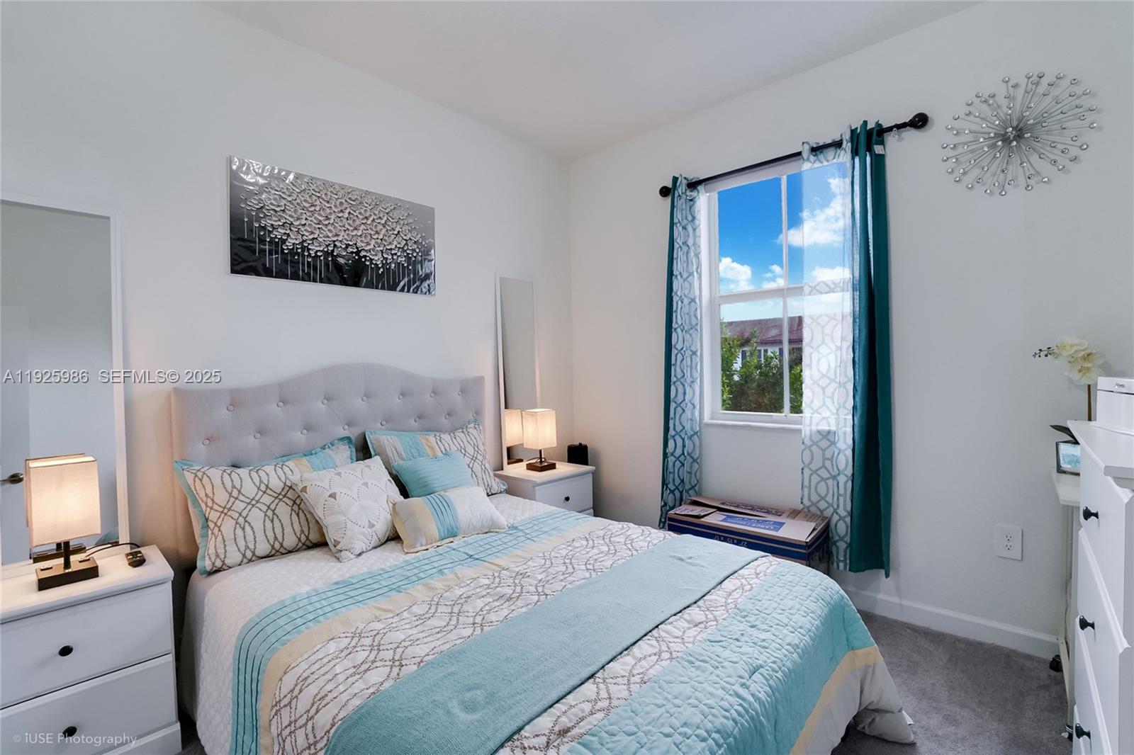 12453 Northwest 23rd Court Miami, FL 33167 - Photo 15 of 15 a bedroom with bed a lamp and a window