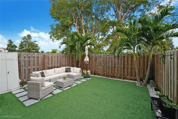 a view of a couches in backyard of house