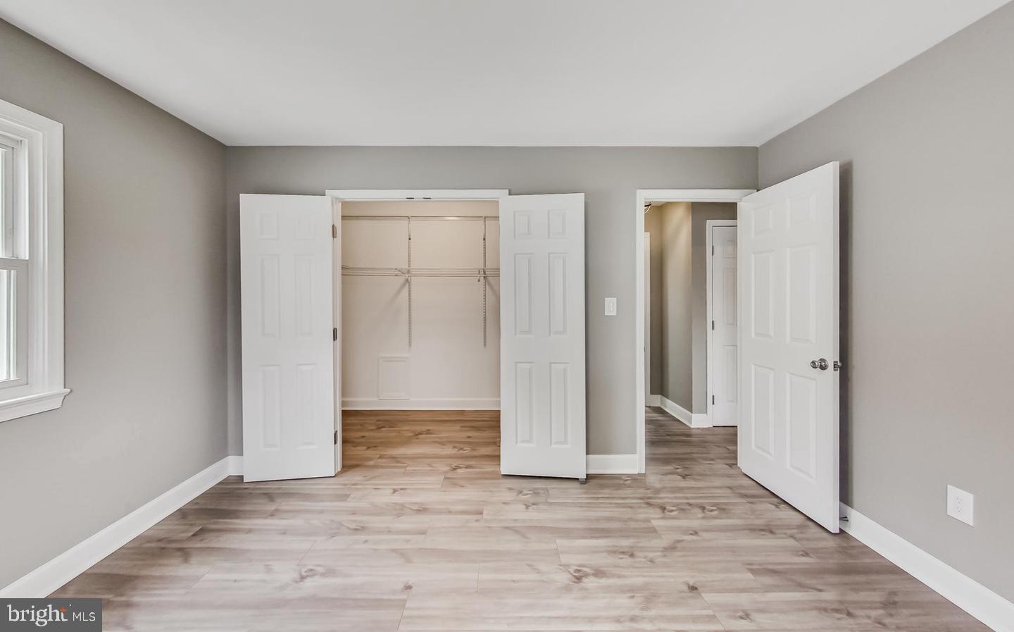 5923 Berwyn Road College Park, MD 20740 - Photo 13 of 51 a view of an empty room with wooden floor and closet