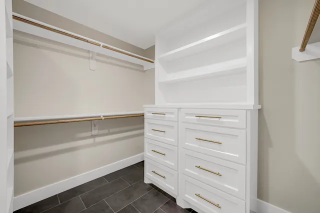 a view of an empty walk in closet