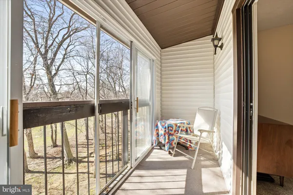 a view of a balcony with furniture