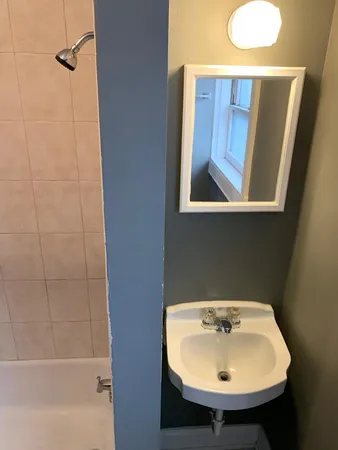 a bathroom with a sink and a window