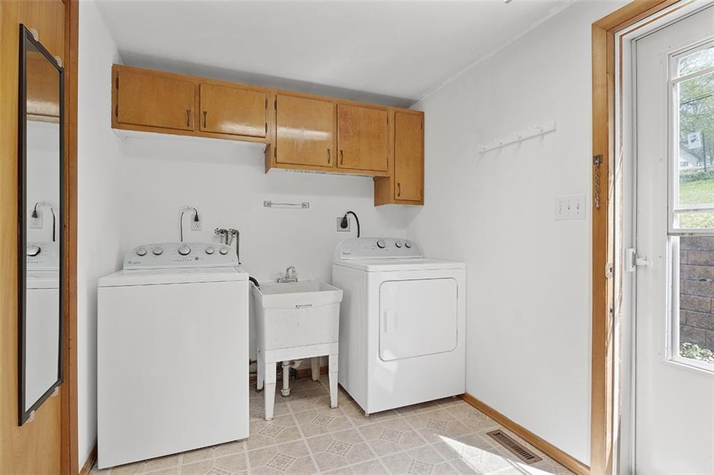 37 Coppola Road Cecil, PA 15321 - Photo 17 of 25 a utility room with cabinets washer and dryer