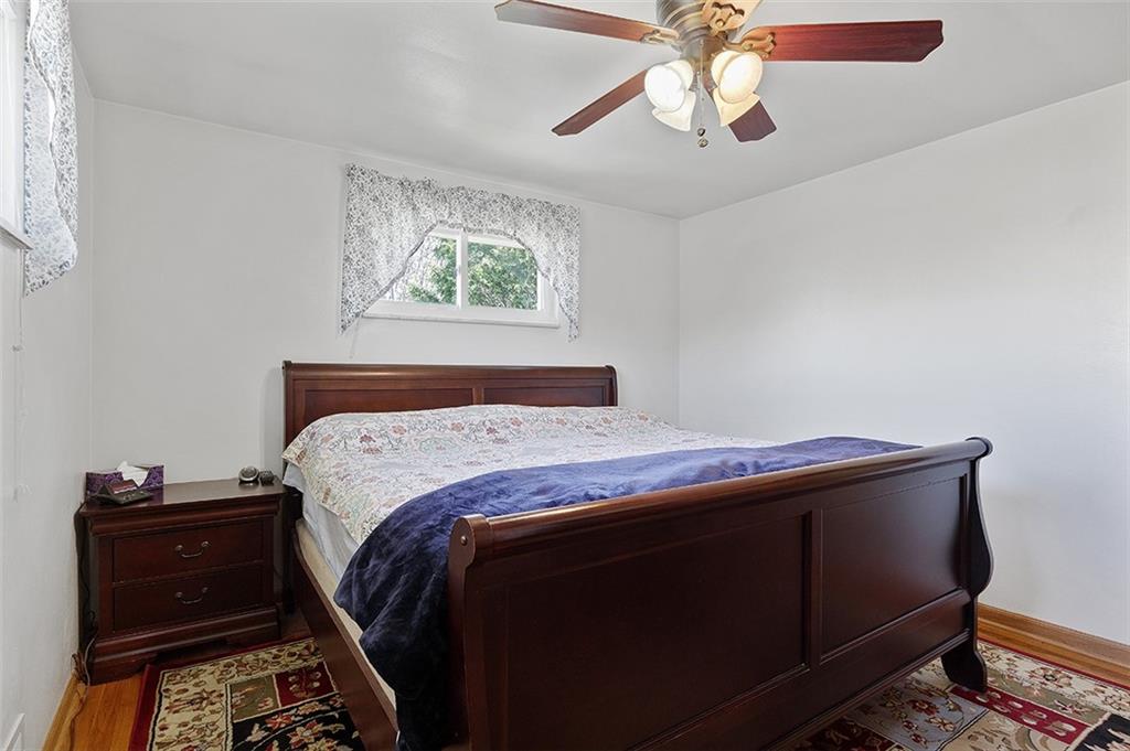 37 Coppola Road Cecil, PA 15321 - Photo 19 of 25 a bedroom with a bed and a chandelier