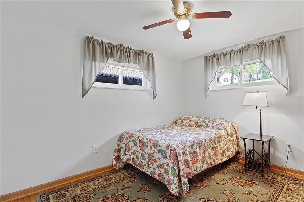 37 Coppola Road Cecil, PA 15321 - Photo 20 of 25 a bedroom with a bed and a lamp