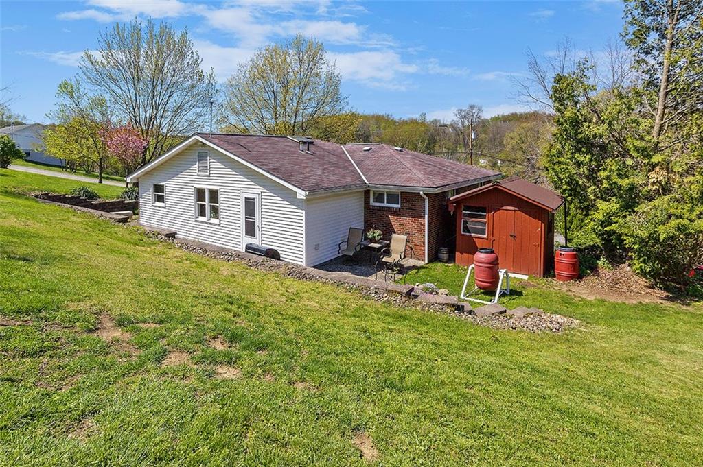 37 Coppola Road Cecil, PA 15321 - Photo 23 of 25 a view of a house with a yard and sitting area