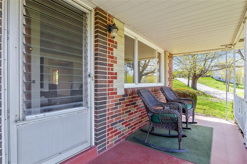 37 Coppola Road Cecil, PA 15321 - Photo 4 of 25 a balcony with table and chairs