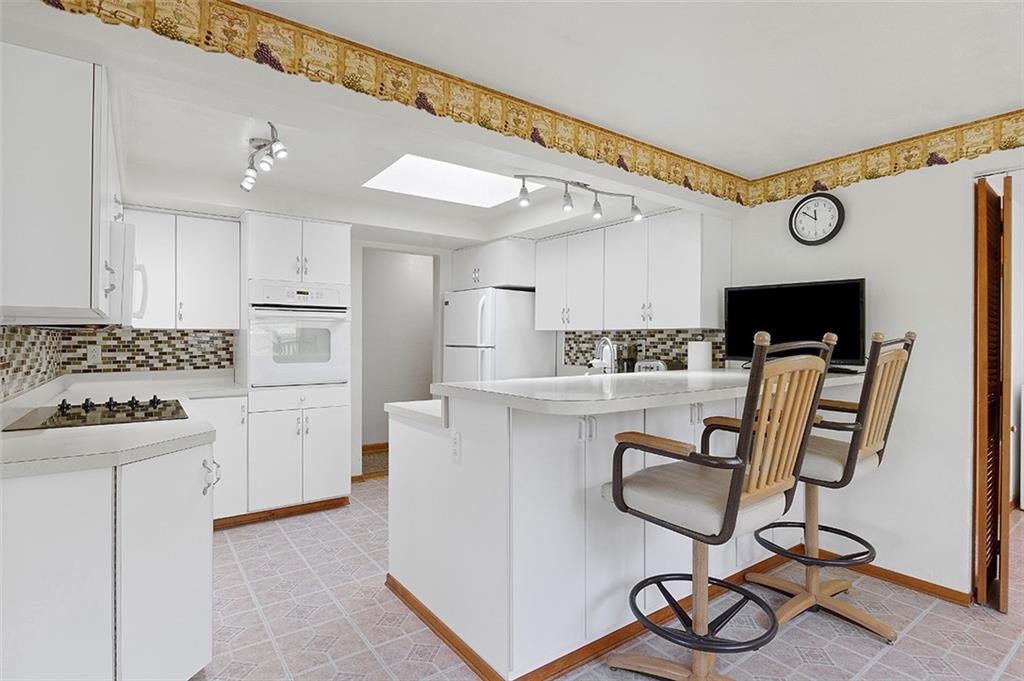 37 Coppola Road Cecil, PA 15321 - Photo 9 of 25 a kitchen with table chairs cabinets and stainless steel appliances